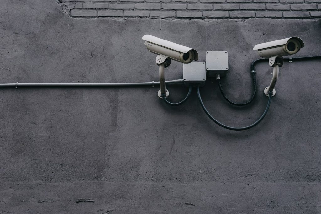 Two bullet CCTV cameras installed on a concrete wall