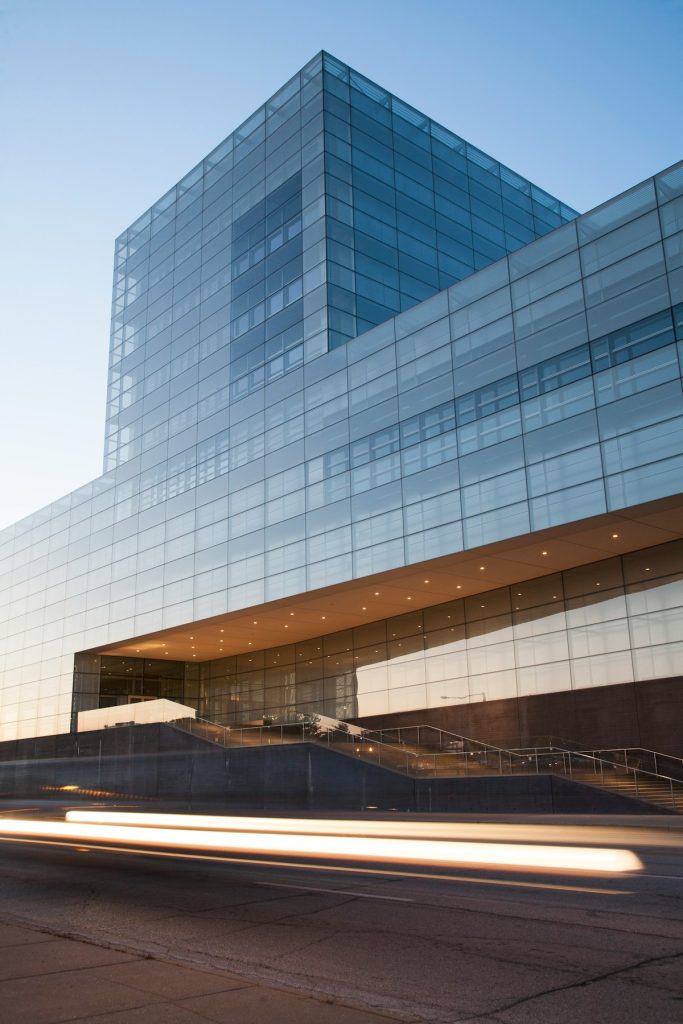 Modern glass commercial building at dusk