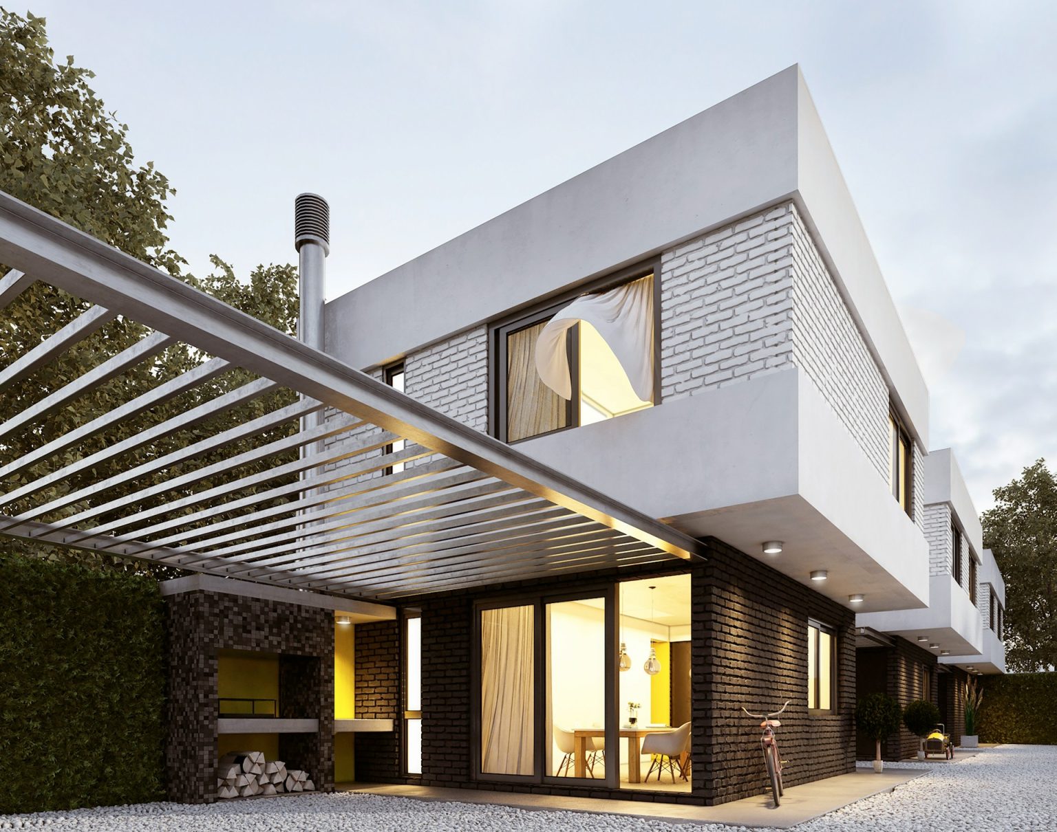 Contemporary home at dusk with warm interior lighting and a pergola