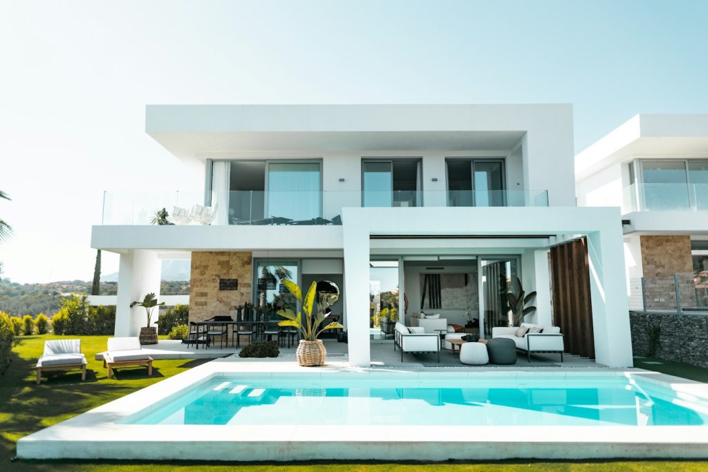 Modern white home with pool and outdoor living area